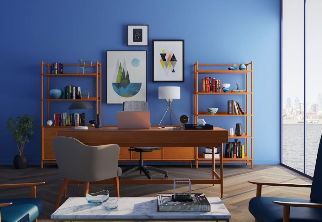 A brown wooden desk with a rolling chair and shelves